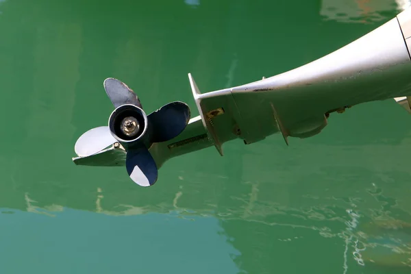 A propeller on a motor boat at the pier. The boat is at the seaport in Tel Aviv