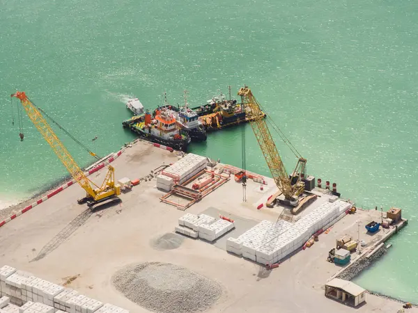 Construction machinery in Dubai works with sand.