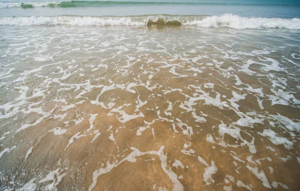 The tide of the waves of the Arabian Sea off the coast of Goa. India. Slow motion view.