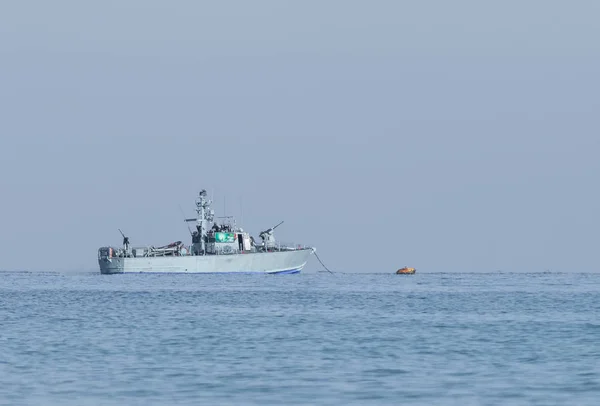 All-weather patrol boat patrol on a cloudy day near the shore of the sea space of the country