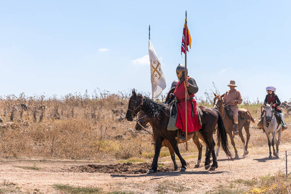 Tiberias, Israel, July 07, 2018 : Reconstruction of Horns of Hattin battle in 1187. Equestrian warriors crusaders go to the battlefield.