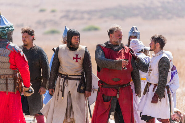 Tiberias, Israel, July 07, 2018 : Reconstruction of Horns of Hattin battle in 1187. Captive knights of the Crusaders are drinking water from the cup, which he offered Saladin.