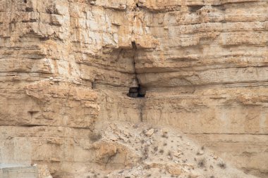 Near Mitzpe Yeriho, Israel, November 25, 2017 : Caves of hermits in the monastery of St. George Hosevit (Mar Jaris) in Wadi Kelt near Mitzpe Yeriho in Israel clipart