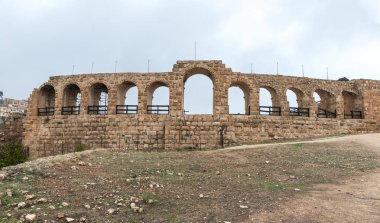 Jerash, Jordan, December 08, 2018 : The outer wall of the hippodrome in the ruins of the great Roman city of Jerash - Gerasa, destroyed by an earthquake in 749 AD, located in Jerash city in Jordan