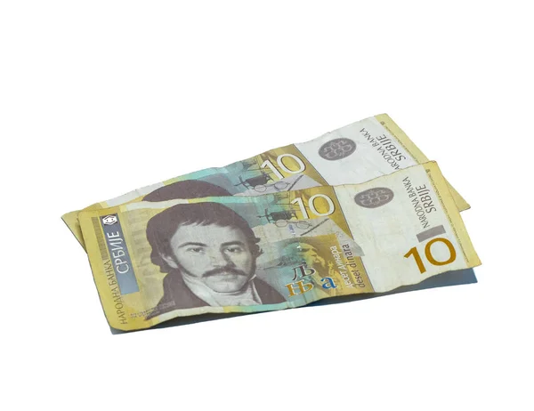 Две купюры стоимостью 10 сербских динаров с портретом лингвиста Вука Караджича на белом фоне — стоковое фото