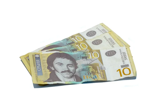 Три купюры стоимостью 10 сербских динаров с портретом лингвиста Вука Караджича на белом фоне — стоковое фото