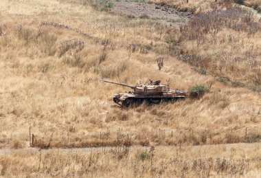 Yok edilen İsrail tankı İsrail 'in Golan Tepeleri' ndeki Kıyamet Günü 'nün (Yom Kippur Savaşı) ardından Suriye sınırına yakın.