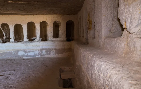 The interior with empty graves of the Roman burial chamber on the ruins of the Nabataean city of Avdat, located on the incense road in the Judean desert in Israel. It is included in the UNESCO World Heritage List.