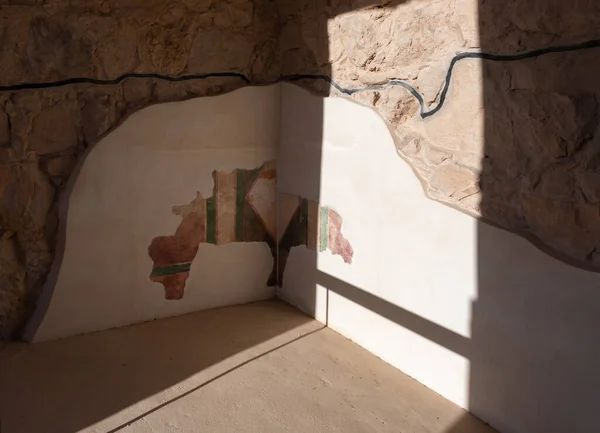 Partially preserved painting on the inner walls of buildings on the territory of the ruins of the Massada fortress, the fortress built by Herod the Great near the Dead Sea. It is in the UNESCO World Heritage List