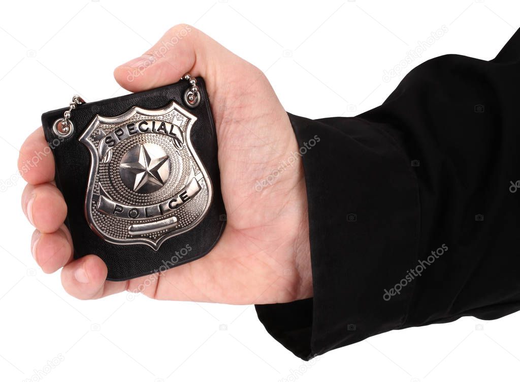 Man is holding police badge
