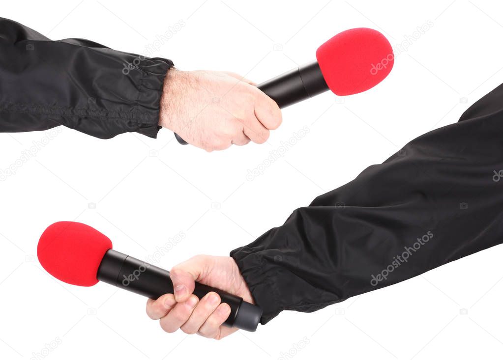 Hand holding red microphone