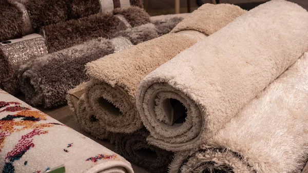 Carpets variety selection rolled up rugs shop store supermarket