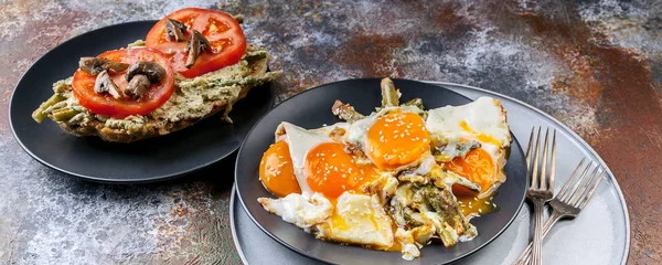 Food banner. Fried eggs with asparagus, sandwich with pesto, tomatoes and mushrooms. Tasty breakfast