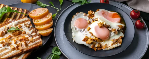 Food banner: Fried eggs and toasts with fried chanterelles. Ideas for a delicious breakfast