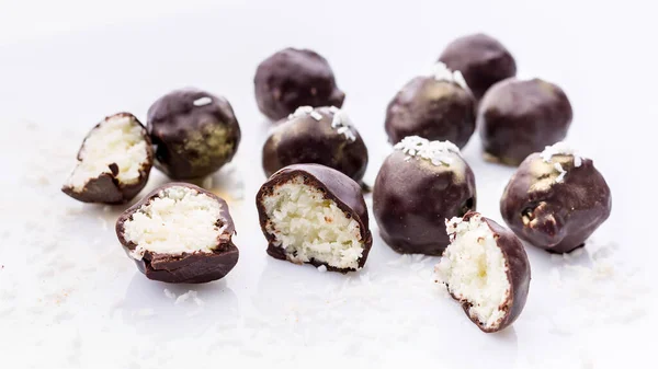 Food banner: Handmade chocolates with coconut and honey. Gourmet chocolate on a white background
