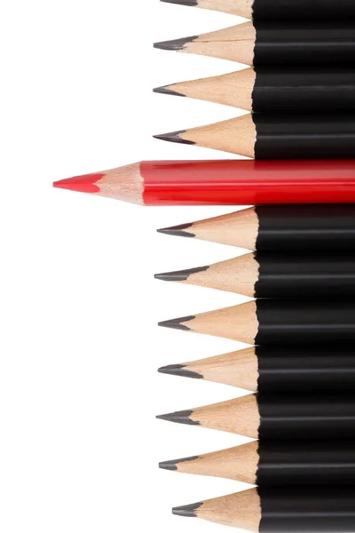 Red pencil among black ones on white background — Stock Photo, Image