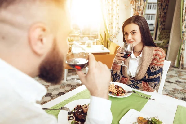 Romantic dinner happy men and women in restaurant
