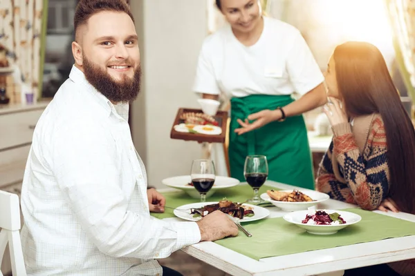 Romantic dinner happy men and women in restaurant