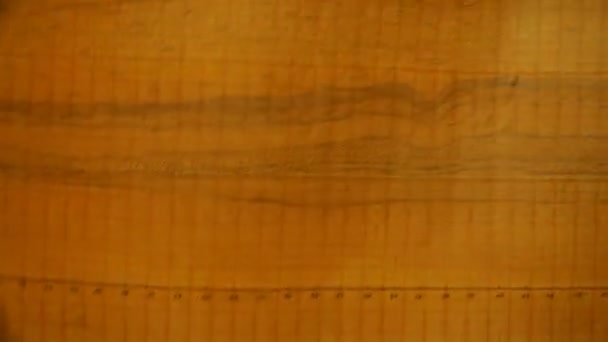 Orange scale-coordinate paper with a drawn profile — Stock Video