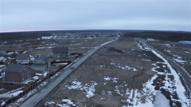 Panorama van vrij besneeuwde land voor residentiële bouw — Stockvideo