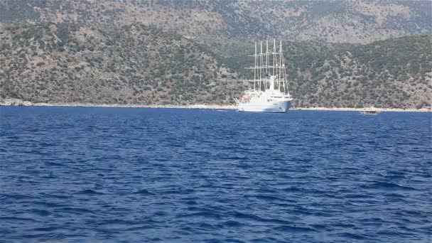 A large ship docked near the coast and lowered the sails — Stock Video