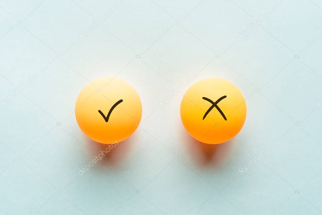 Check mark concept, yes or no dilemma concept with ping pong balls.