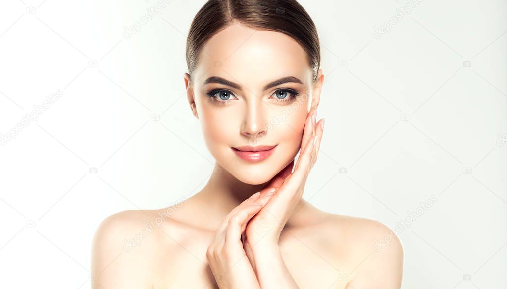 Beautiful Young Woman with Clean Fresh Skin. Face care . Facial treatment . Cosmetology , beauty and spa .