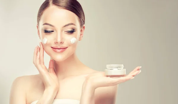 Beautiful Young Woman Applying Cosmetic Cream Treatment Her Face Isolated — Stock Photo, Image