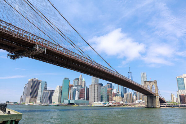 Manhattan, New York City - May 10, 2018 : The Brooklyn Bridge with New York skyline