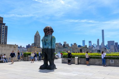 New York, USA - May 12, 2018 : Rooftop view of Metropolitan Museum of Art with Manhattan skyline over Central park. clipart