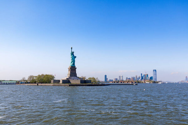 The Statue of Liberty in New York City against the blue sky