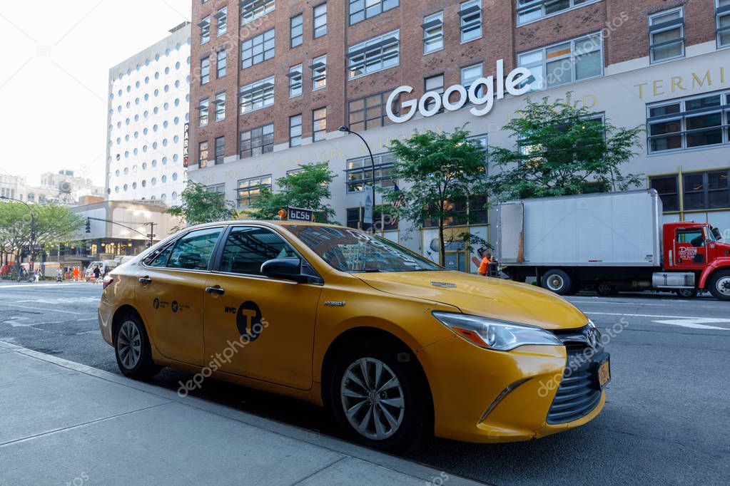 Yellow cab driving past the New York City google offices in Chelsea, Manhattan