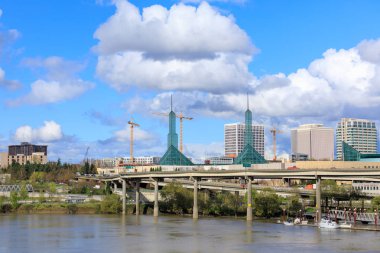 Portland, United States - Apr 10, 2018 : Oregon Convention Center, that is located on the east side of the Willamette River in the Lloyd District neighborhood clipart