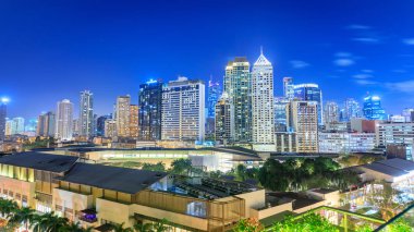 Manila, Philippines - Feb 24, 2018 : Eleveted, night view of Makati, the business district of Metro Manila, Philippines clipart