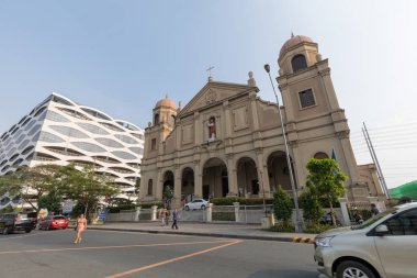 Manila, Philippines - Feb 10, 2018 : Facade of catholic churches beside in the Mall of Asia shopping mall of Pasay City, Philippines clipart