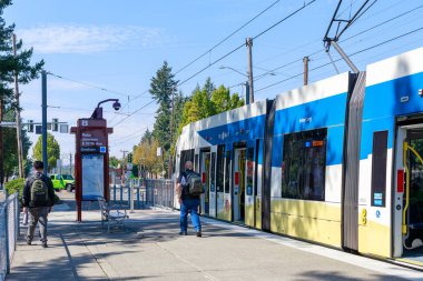 Portland, Oregon - Sep 8, 2018 : A Trimet light rail train heading through a city near Ruby Junction MAX station