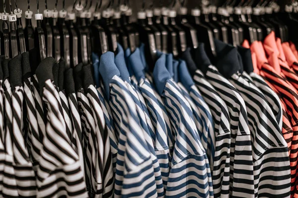Striped shirt on hanger in a shop
