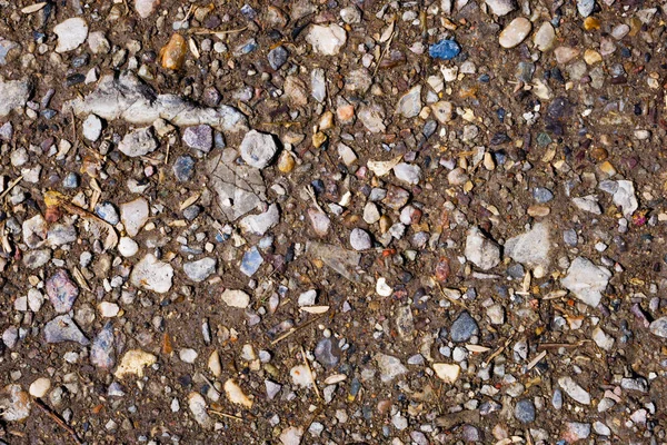 Nahaufnahme Von Zerkleinerten Kleinen Steinen Kies Braunem Boden Für Textur — Stockfoto