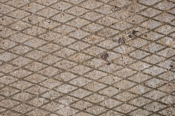콘크리트 포장의 기하학적 다이아몬드 모양 패턴 — 스톡 사진