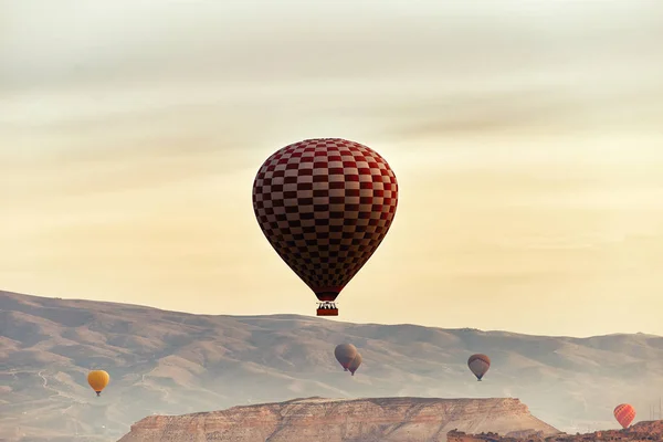 Beautiful balloons against the backdrop of a mountain landscape in the summer.