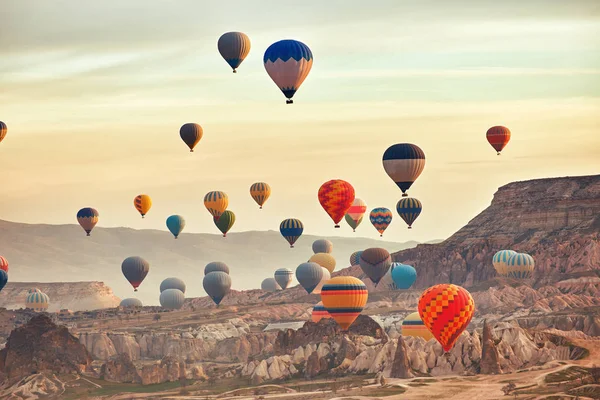 Beautiful balloons against the backdrop of a mountain landscape in the summer.
