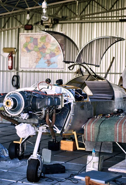 Light  single-engine aircraft for maintenance of the engine in the hangar .