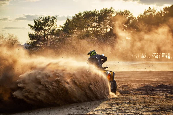 Racing in the sand on a four-wheel drive quad. — Stock Photo, Image