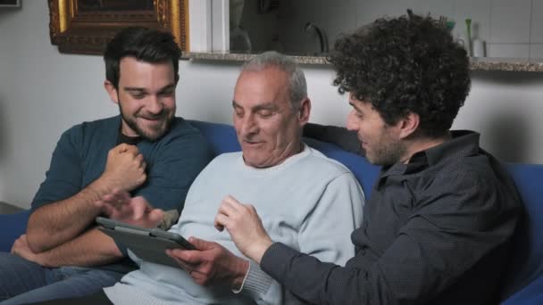 Close Father Sons Sitting Sofa Watching Tablet — Stock Video