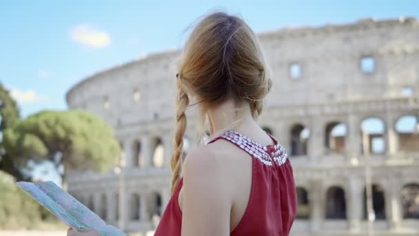 Portrait Happy Young Tourist Colosseum Smiles Consults Map — Stock Video