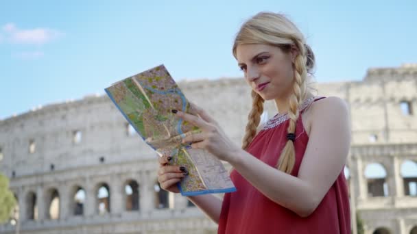 Young Blonde Tourist Rome Consulting City Map Colosseum Background — Stock Video