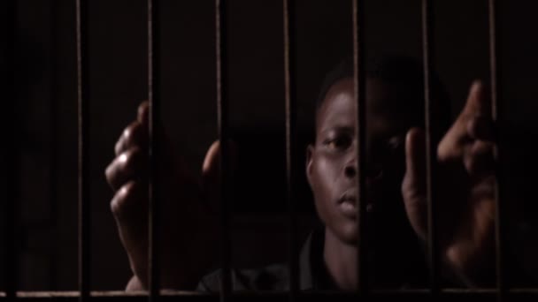 Sad Young Black American Dark Jail Holding Bars Crime Law — Stock Video