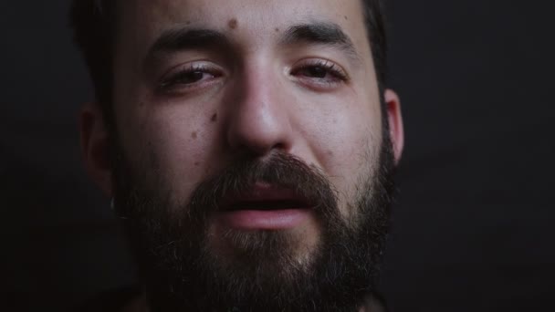 Close Portrait Sad Bearded Man Crying Dark Looking Camera — Stock Video