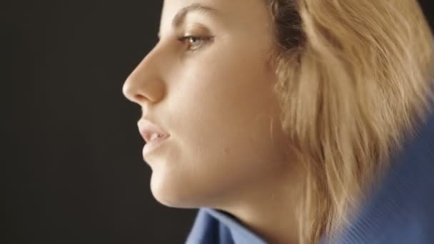 Close Still Sleepy Young Woman Puts Blue Sweater — Stock Video