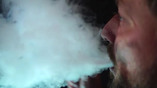 Man smokes hookah in a bar. slow motion.close-up — Stock Video